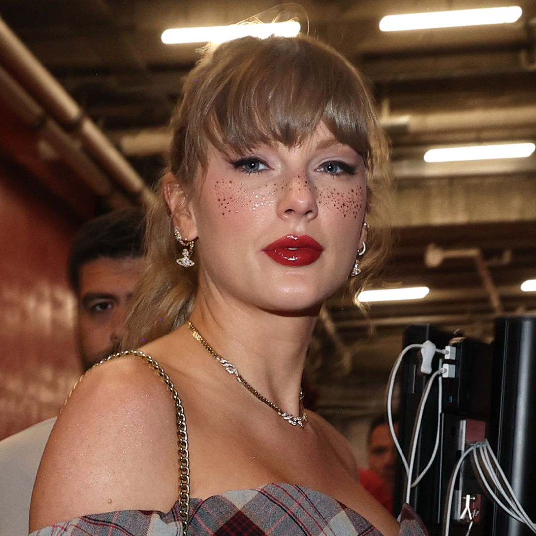 Taylor Swift wearing a plaid mini dress