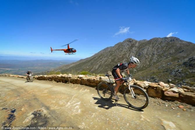 James Reid powers ahead of his Asrin Cycling teammate, Jens Schuermans on the Swartberg Pass on their way to winning Stage 2