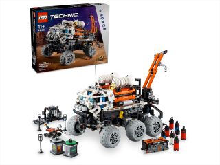 photo of a six-wheeled lego rover, with the set's box in the background