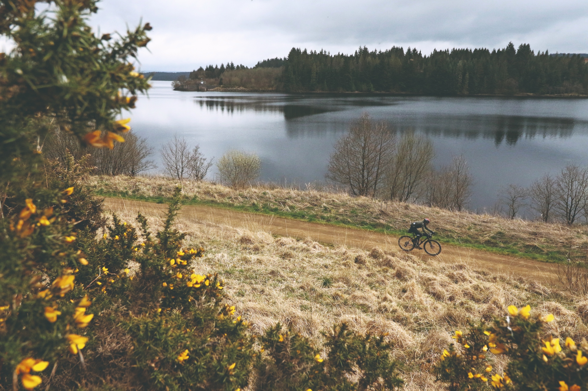 A lone Gravel rider with Kielder Water in the background