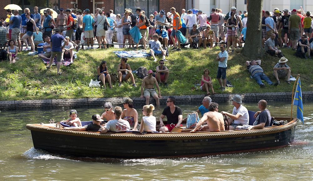 Spectators watch the action from a boat.