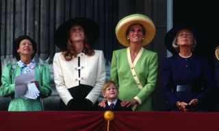 Princess Margaret, Countess of Snowdon, Sarah, Duchess of York, Prince Harry, Diana, Princess of Wales and the Duchess of Kent stand on the balcony of Buckingham Palace
