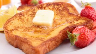 French toast with a pat of butter melting on top