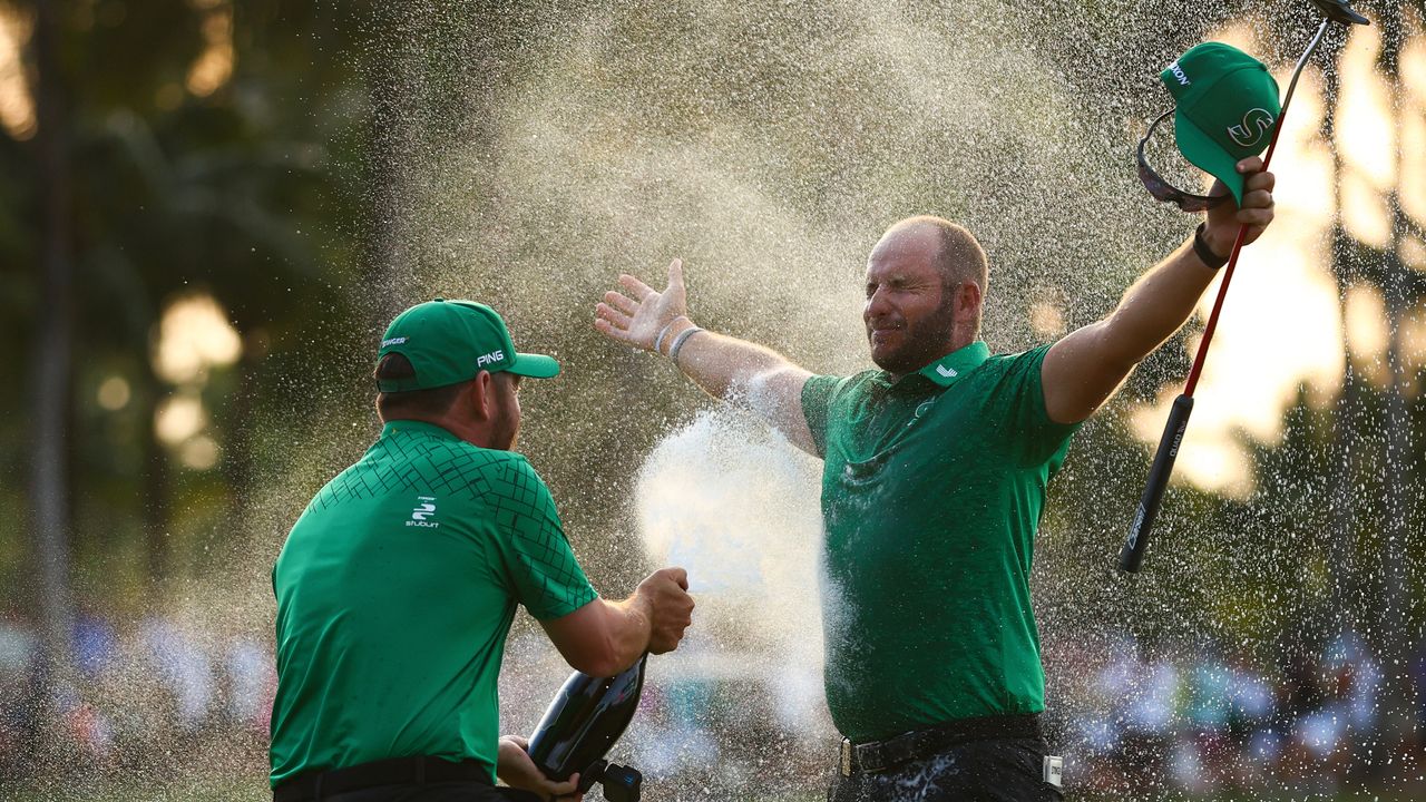 Dean Burmester sprayed with champagne after winning LIV Golf Miami