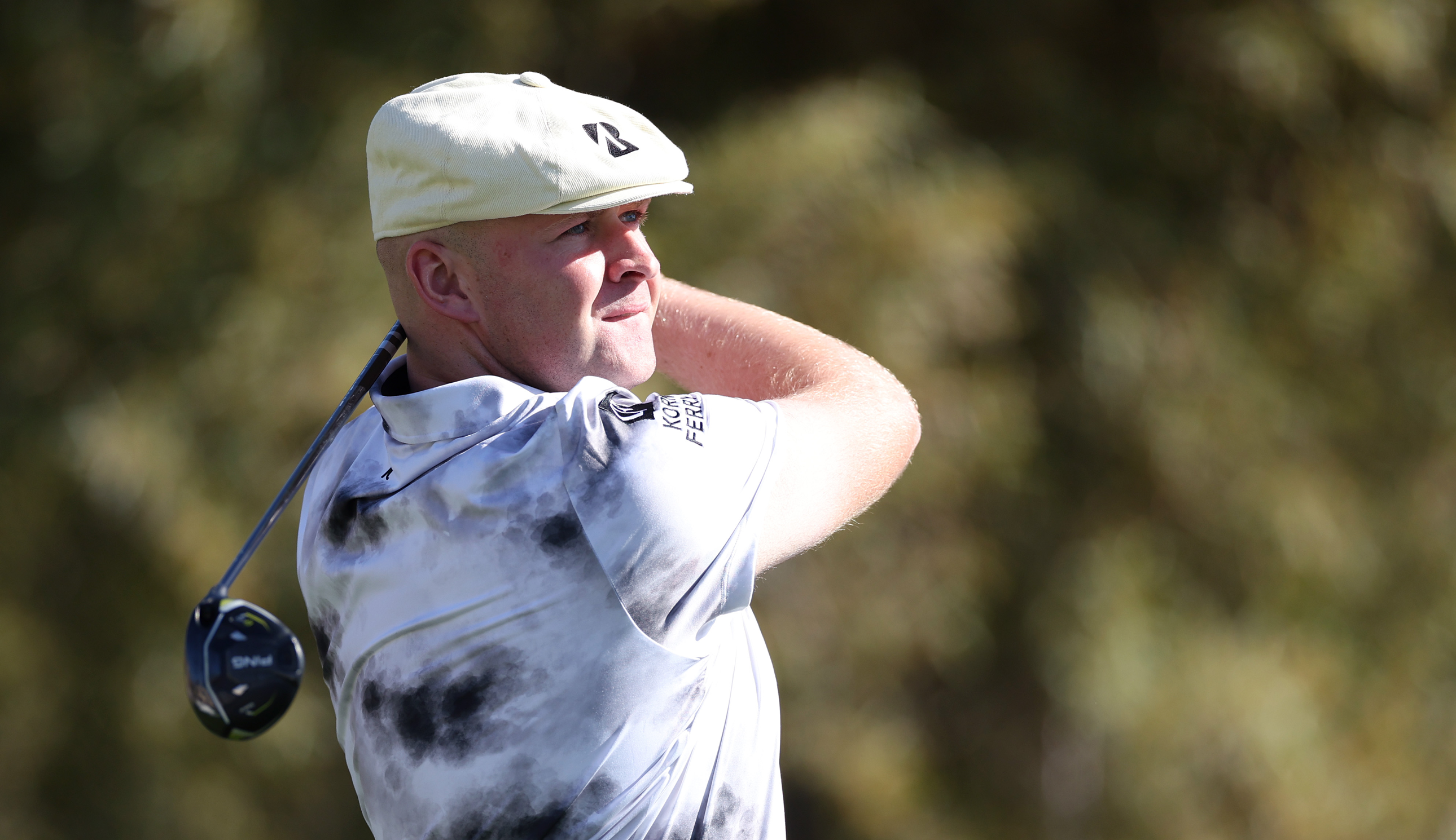 Harry Hall hits a fairway wood