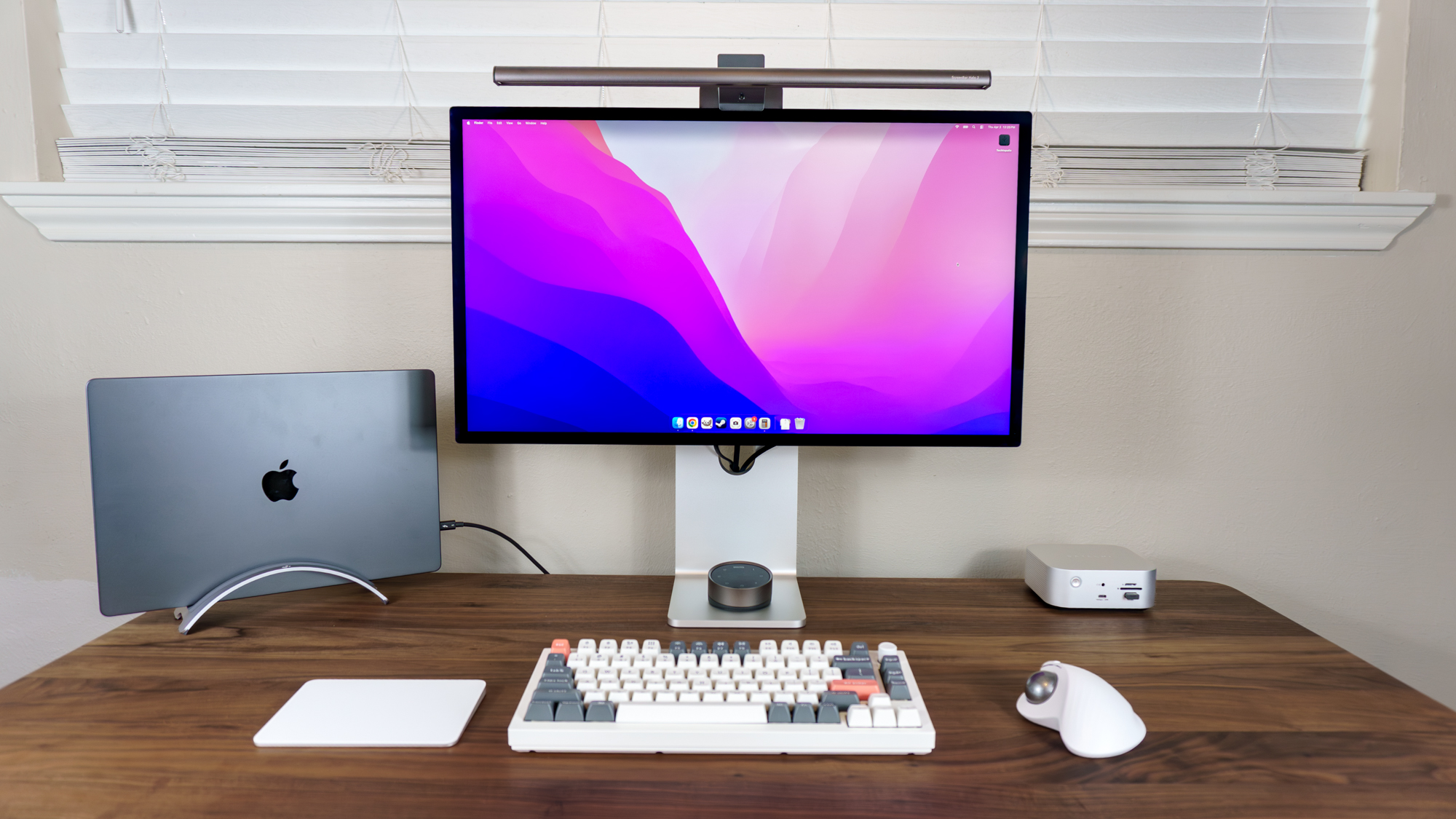 A MacBook Pro M5 Pro and a Studio Display XDR on a desk connected to a Satechi Thunderbolt 5 CubeDock