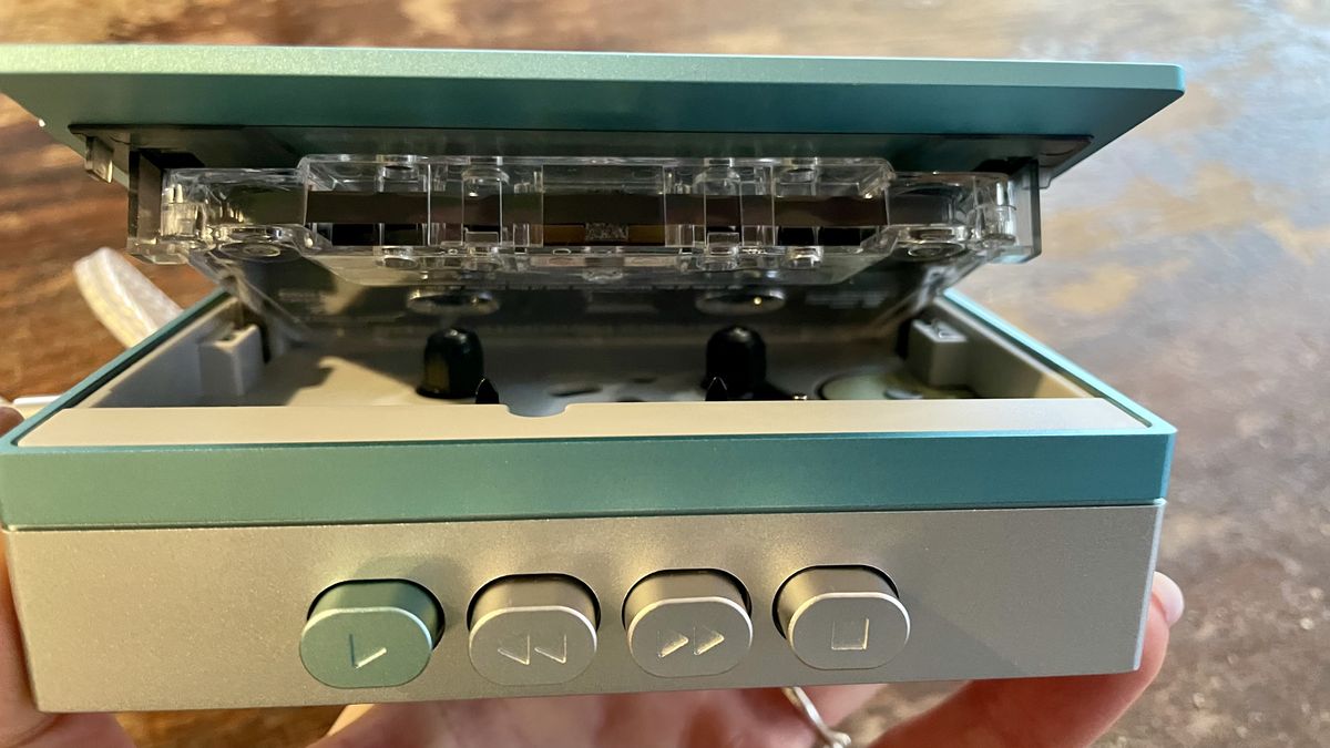 FiiO CP13 with a tape in the open-door player