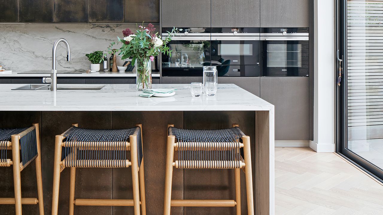 Modern kitchen with island and waterfall worktop