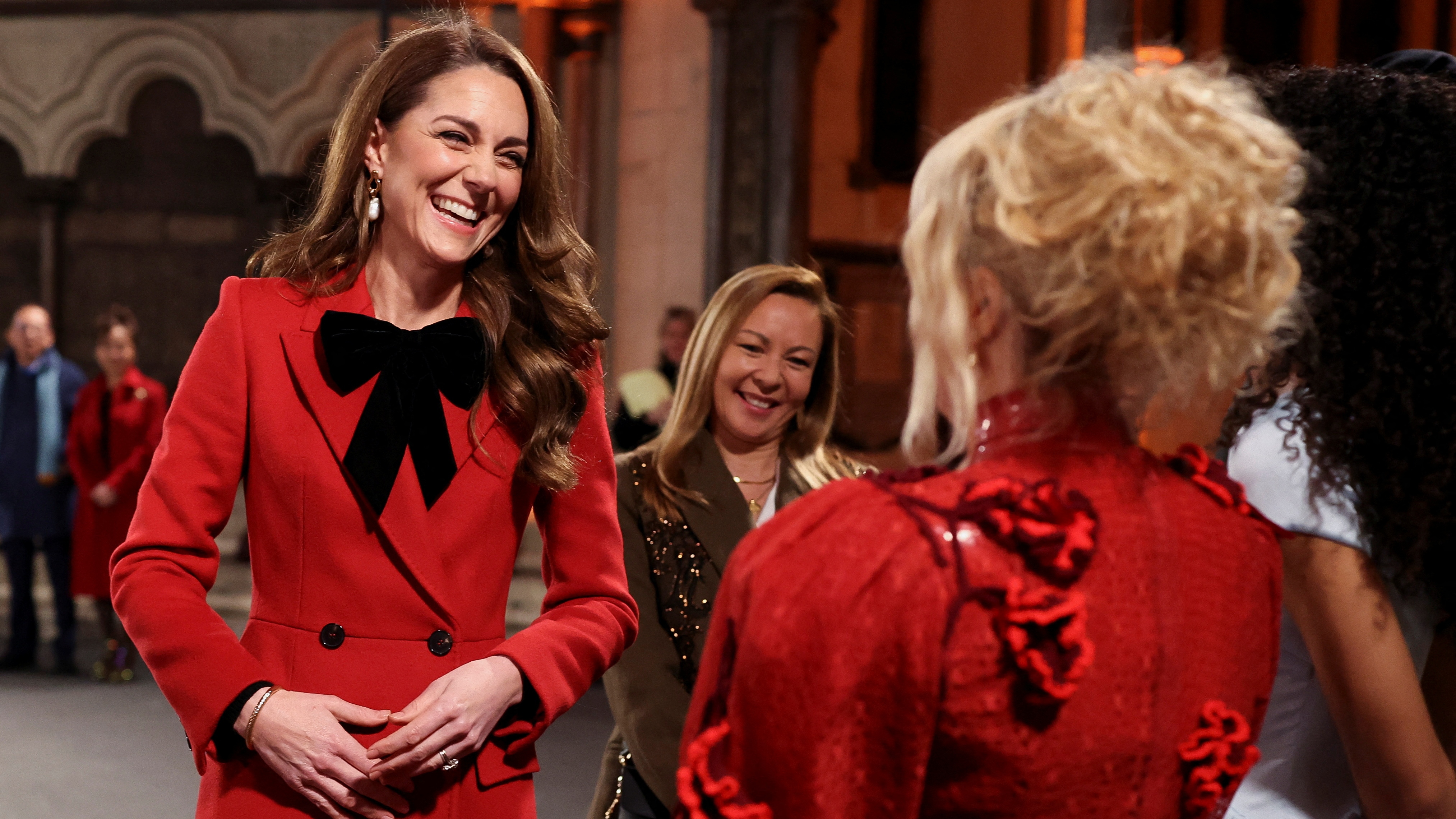 Catherine, Princess of Wales talks with Paloma Faith, Olivia Dean and Gregory Porter during the 'Together At Christmas' Carol Service at Westminster Abbey on December 06, 2024