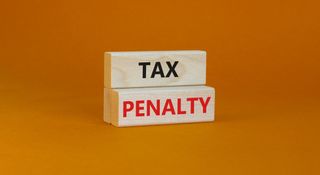 Time to tax penalty symbol. Concept words Tax penalty on wooden blocks on a beautiful orange background. Business and tax penalty concept.