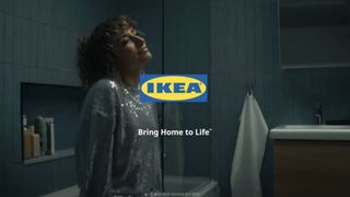 Screenshot from the new Ikea ad showing a woman relaxing in a room on her own 