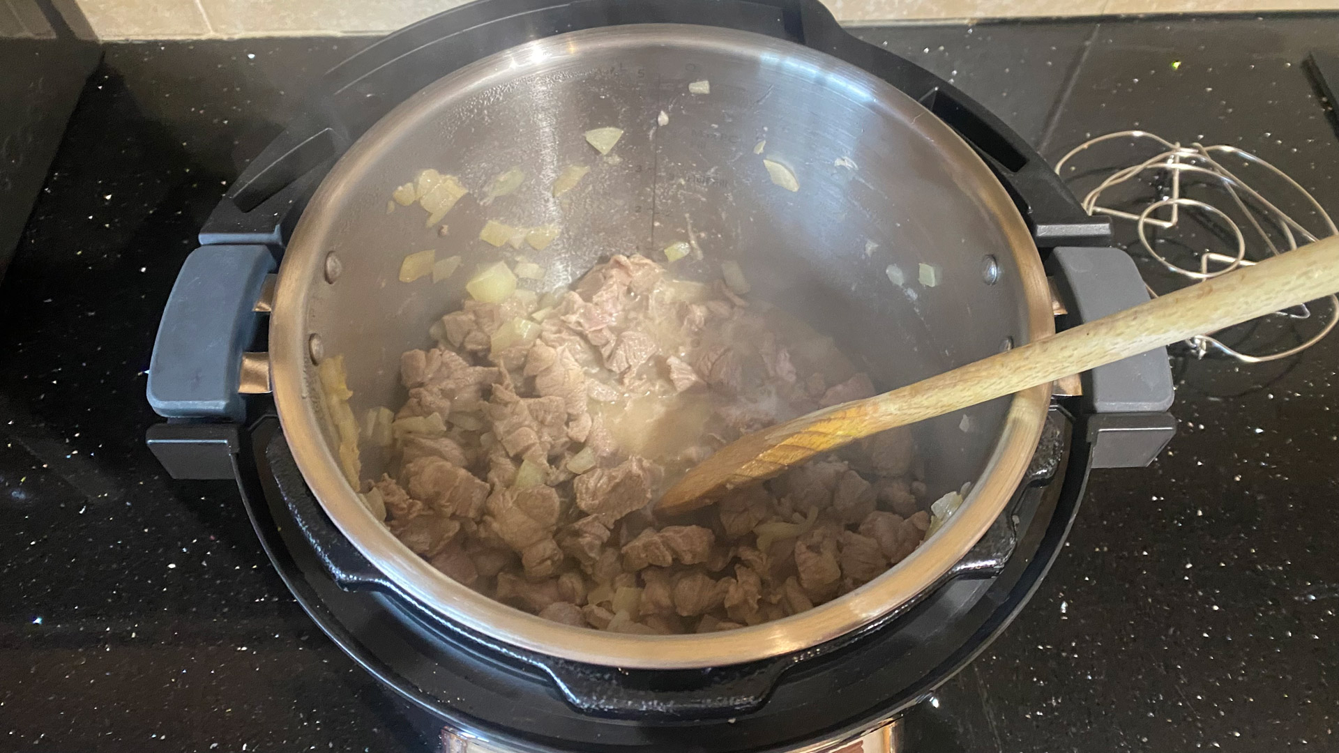 Saute-ing lamb for slow cooked lamb curry in the Instant Pot Pro Plus Smart Multi-Cooker