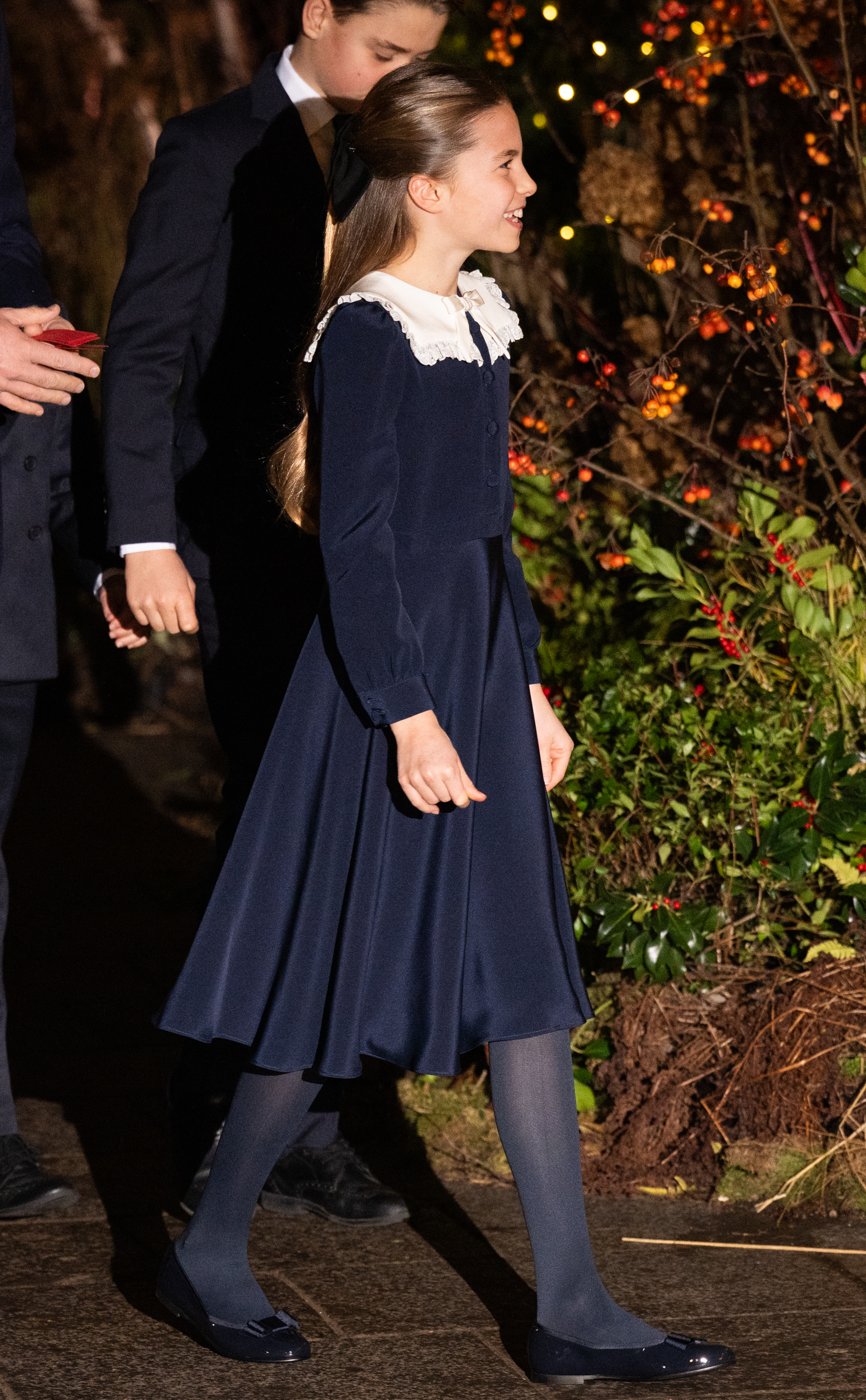 Princess Charlotte wearing a blue jacket and dress at the Together at Christmas concert