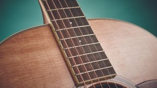 Close up of acoustic guitar strings