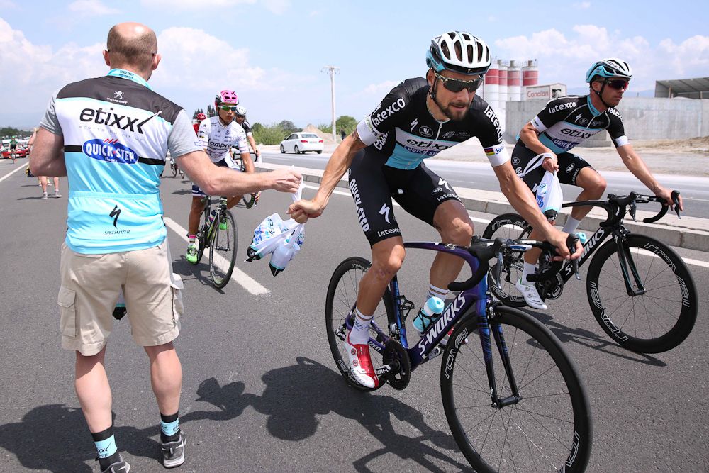 Tom Boonen grabs a feed bag.
