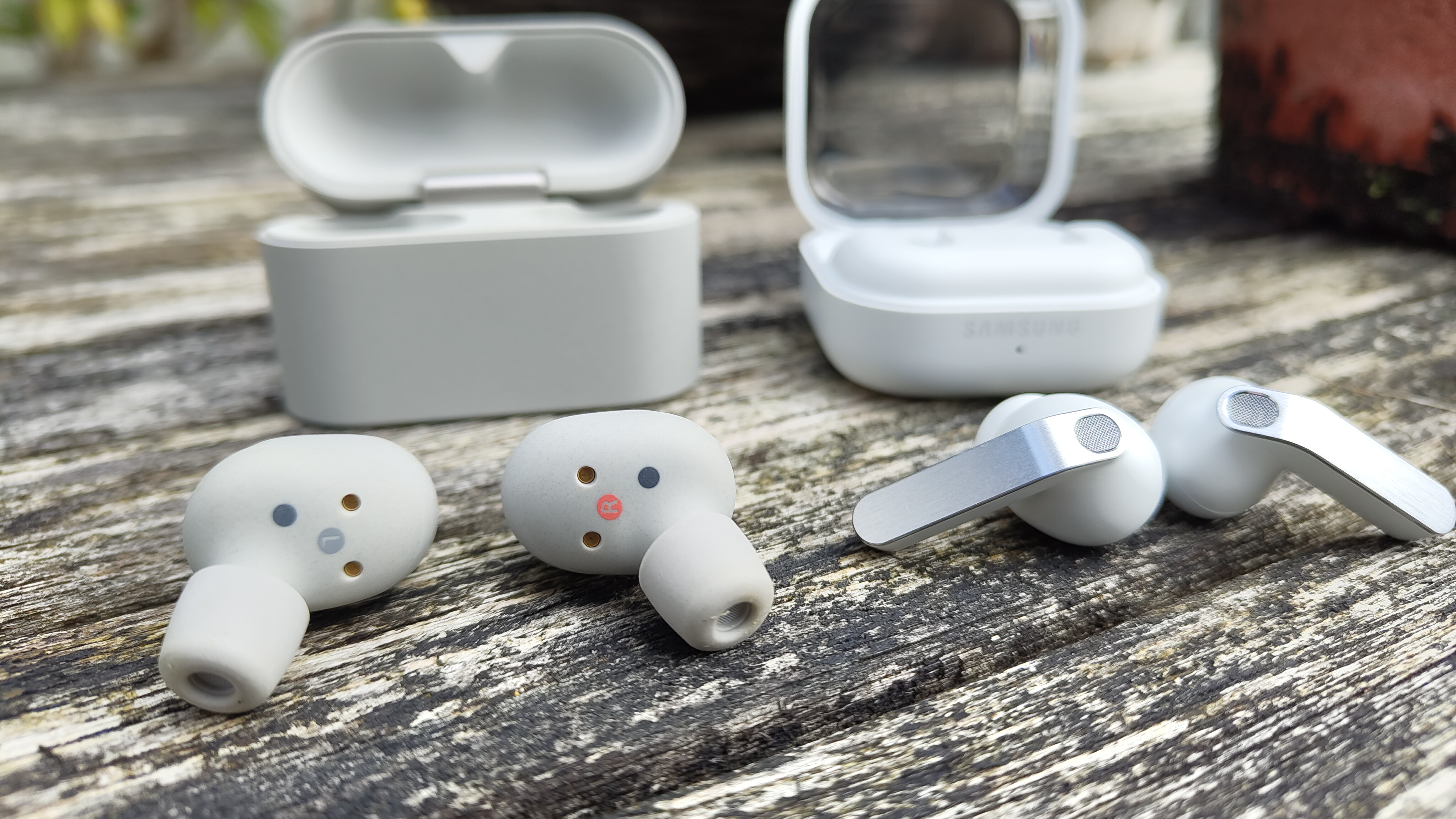 Sony WF-1000XM6 vs Samsung Galaxy Buds 4 Pro wireless earbuds placed side-by-side