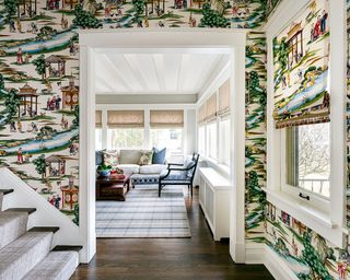 Hallway ideas shown with maximalist wallpaper and matching blinds looking towards sitting room