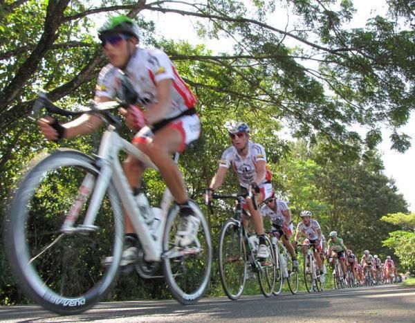 The peloton strings out as a group moves off the front, increasing speeds back in the bunch.