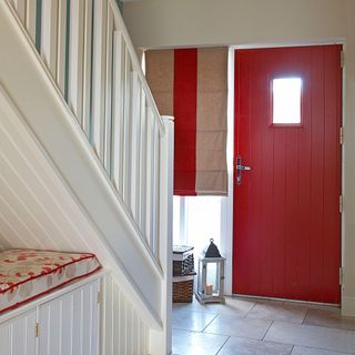 red front door in hallway