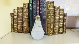 Nanoleaf Matter Essentials smart bulb unplugged and standing on a desk
