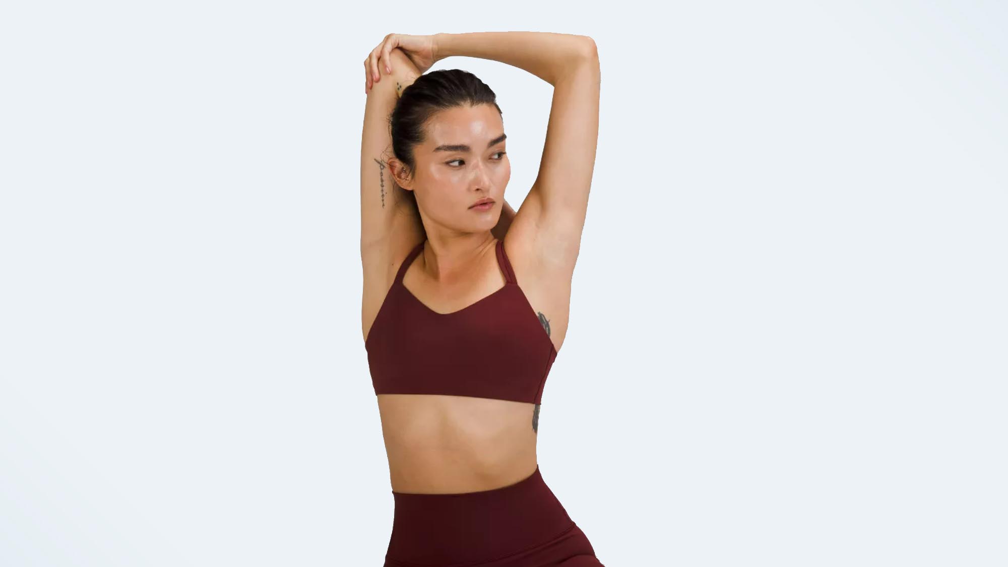 A photo of a woman wearing the Lululemon Like a Cloud sports bra, one of the best low-impact sports bras