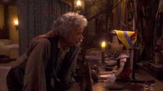 Geppetto adds the finishing touches to Pinocchio in his workshop in Disney's live-action remake
