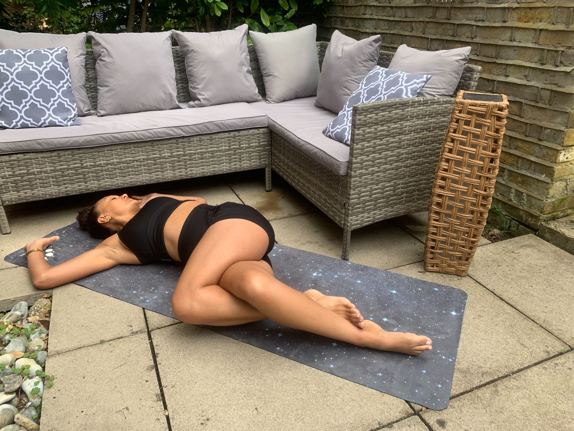 Yoga instructor Simone Venner demonstrates reclined eagle twist