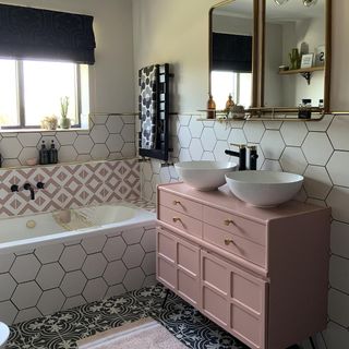 bathroom with mirror and tiles on wall