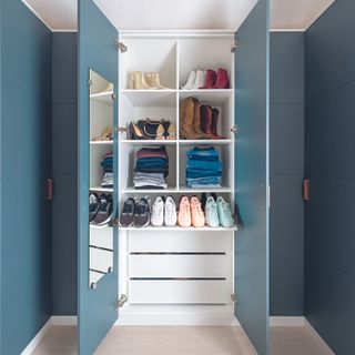 Navy wardrobes with IKEA fitted drawers