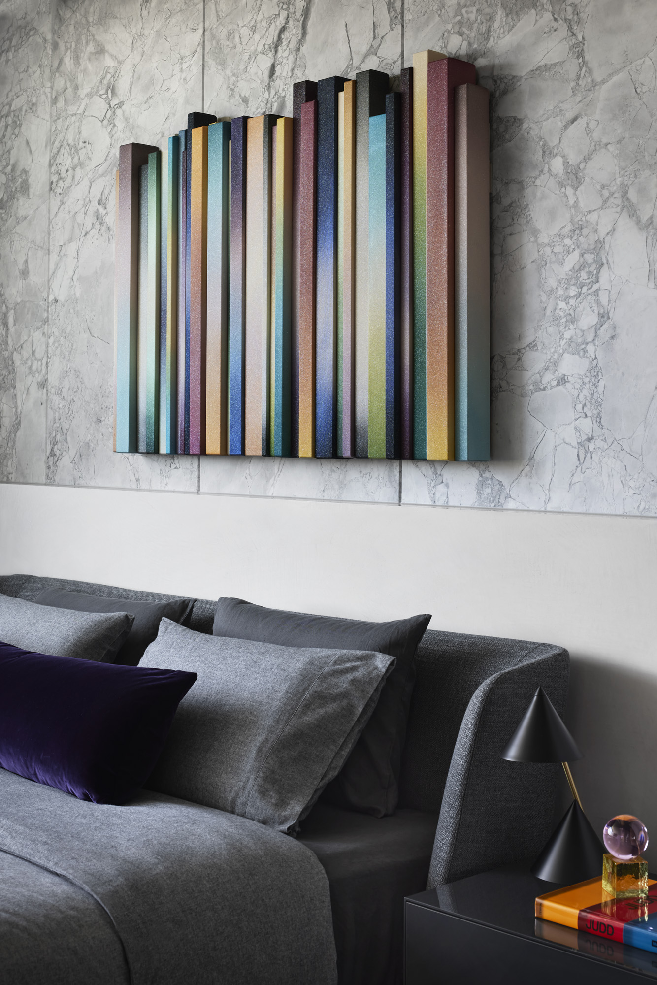bedroom with colourful art above headboard in Curatorial House in Melbourne