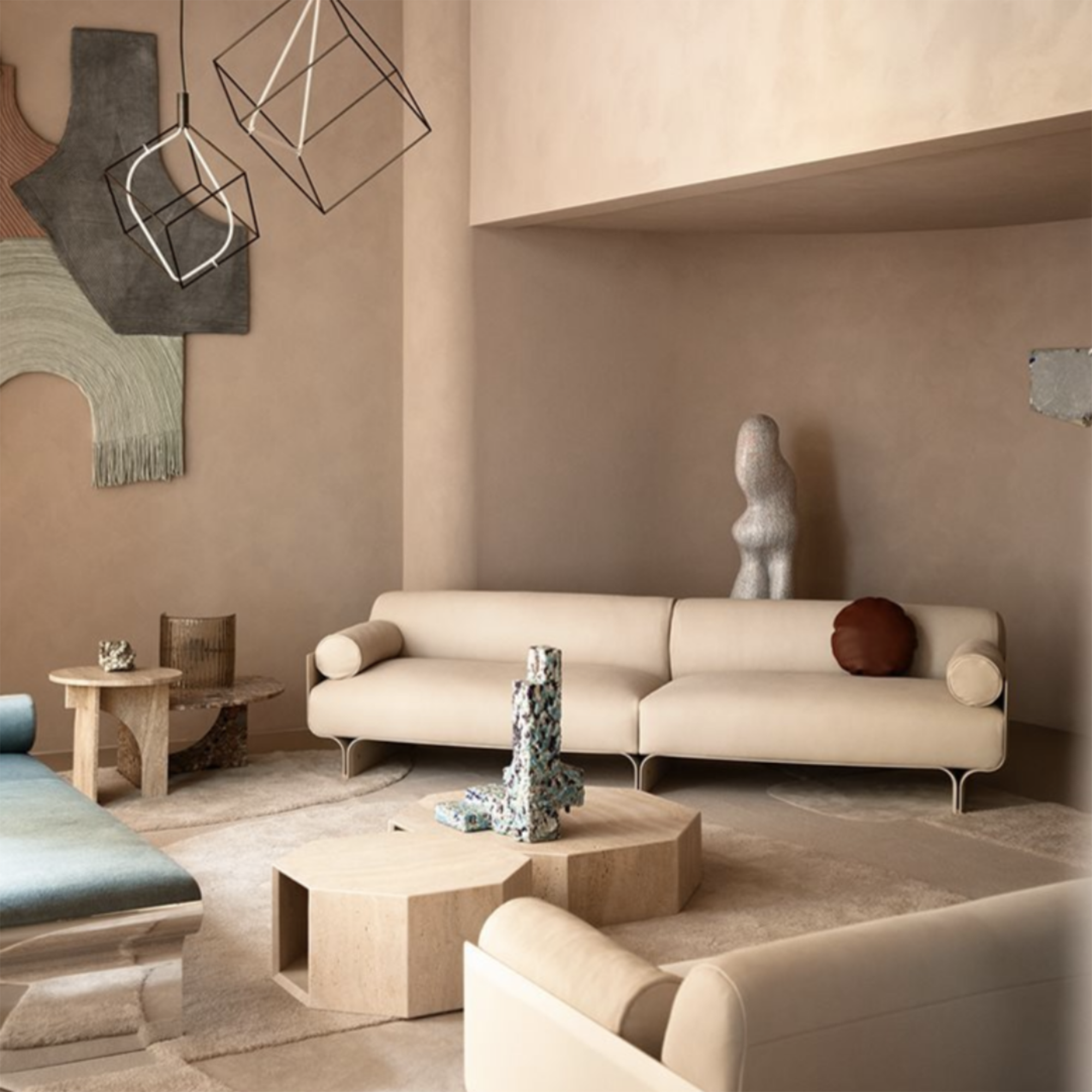 cream sofa in a pale pink living room