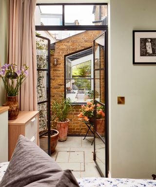 First-time buyers Lois and Guy used their industry skills to turn a tired old ground-floor flat into a spacious modern home