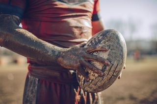 Man holding rugby ball
