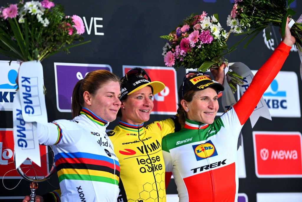 NINOVE BELGIUM FEBRUARY 24 LR Lotte Kopecky of Belgium and Team SD WorxProtime on second place race winner Marianne Vos of The Netherlands and Team Visma Lease A Bike and Elisa Longo Borghini of Italy and Team LidlTrek on third place pose on the podium ceremony after the 16th Omloop Het Nieuwsblad 2024 Womens Elite a 1271km one day race from Ghent to Ninove UCIWWT on February 24 2024 in Ninove Belgium Photo by Luc ClaessenGetty Images