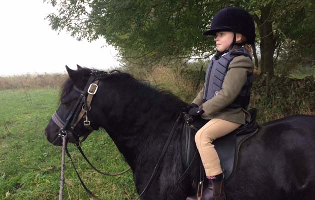 Aminta Dawson, age six, out hunting for the first time with the High Peak on her pony Ellie May (despite the early start and the misty day she loved it)