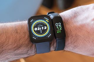 Fitbit Inspire 3 on the same wrist as an Amazfit Bip 5.