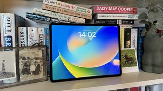 iPad Pro (2022) on a book shelf.