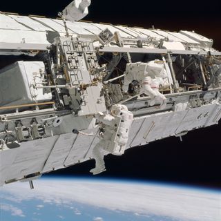 NASA astronaut Michael Lóopez-Alegria snaps a photo during a spacewalk outside the International Space Station during a months-long mission to the International Space Stationstation in February 2007.