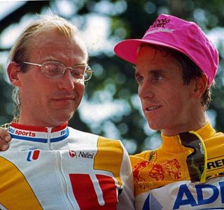 1989 Tour de France winner Greg LeMond talks to runner-up Laurent Fignon on the podium in Paris.