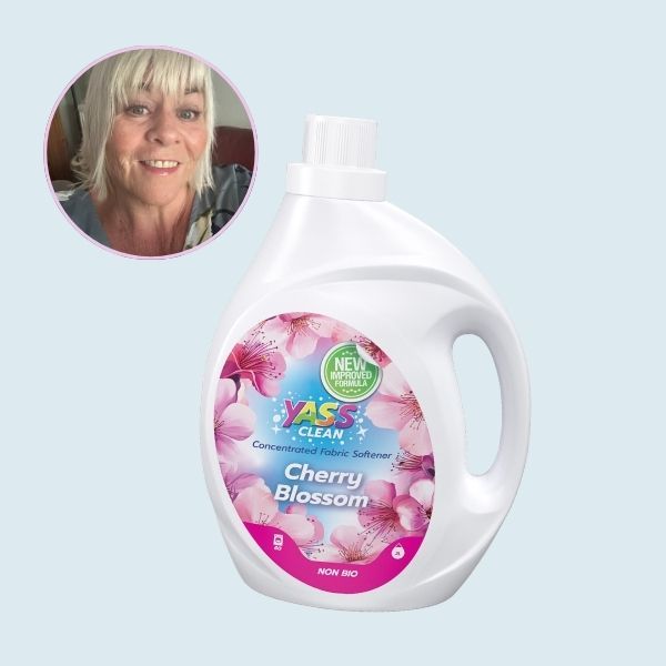 A bottle of Yass Clean Fabric Softener, with an inset portrait of the tester.