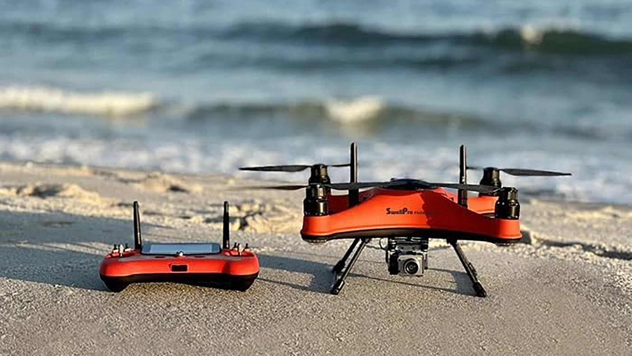 SwellPro FD3 drone and controller by the sea
