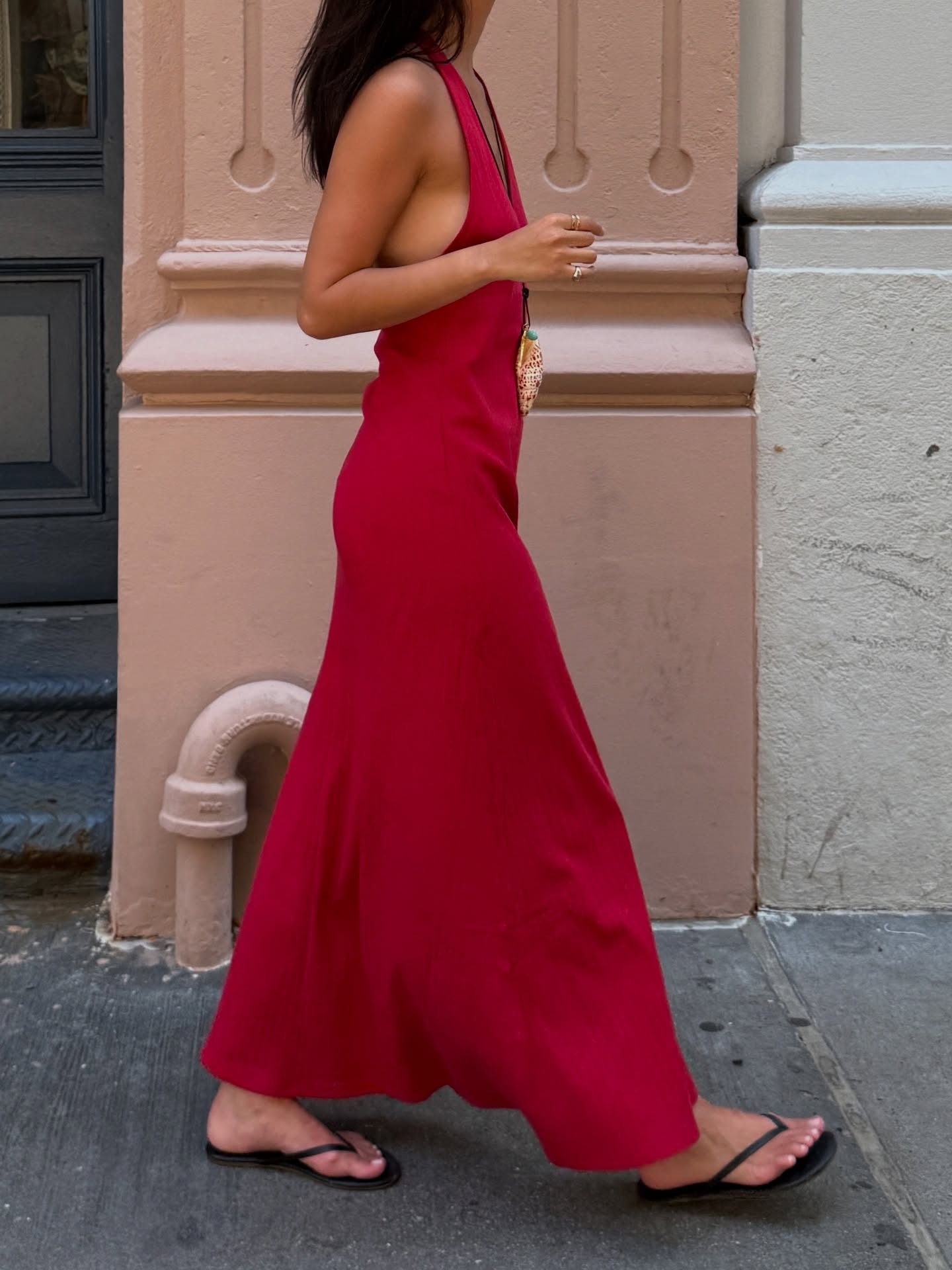 Mimi wearing red dress and black flip flps