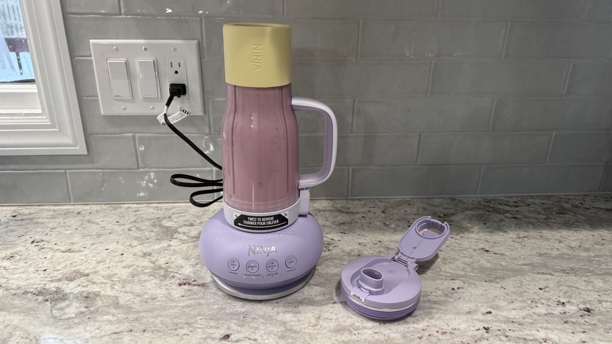 Ninja BlendBOSS&trade; Tumbler Blender with 26oz Travel Tumbler making a cherry smoothie