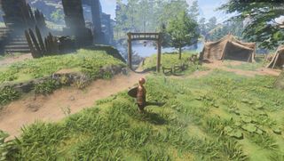 Enshrouded screenshot of a player standing at the ready on the open path