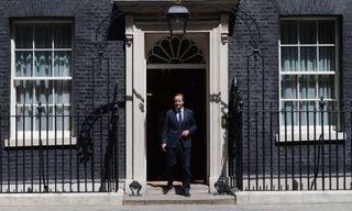 David Cameron stepping out of Downing Street