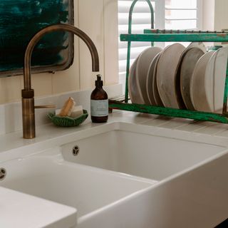 white wash basin dishes soap and brush