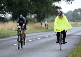 Mark Woolford passes a caped rider, National 10-mile time trial 2015