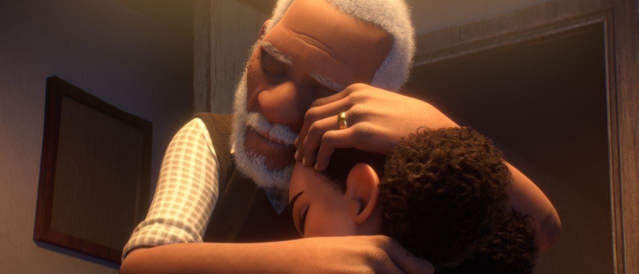 A grandfather holds his young granddaughter