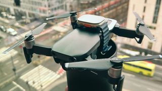 Apple Watch Ultra strapped to a drone