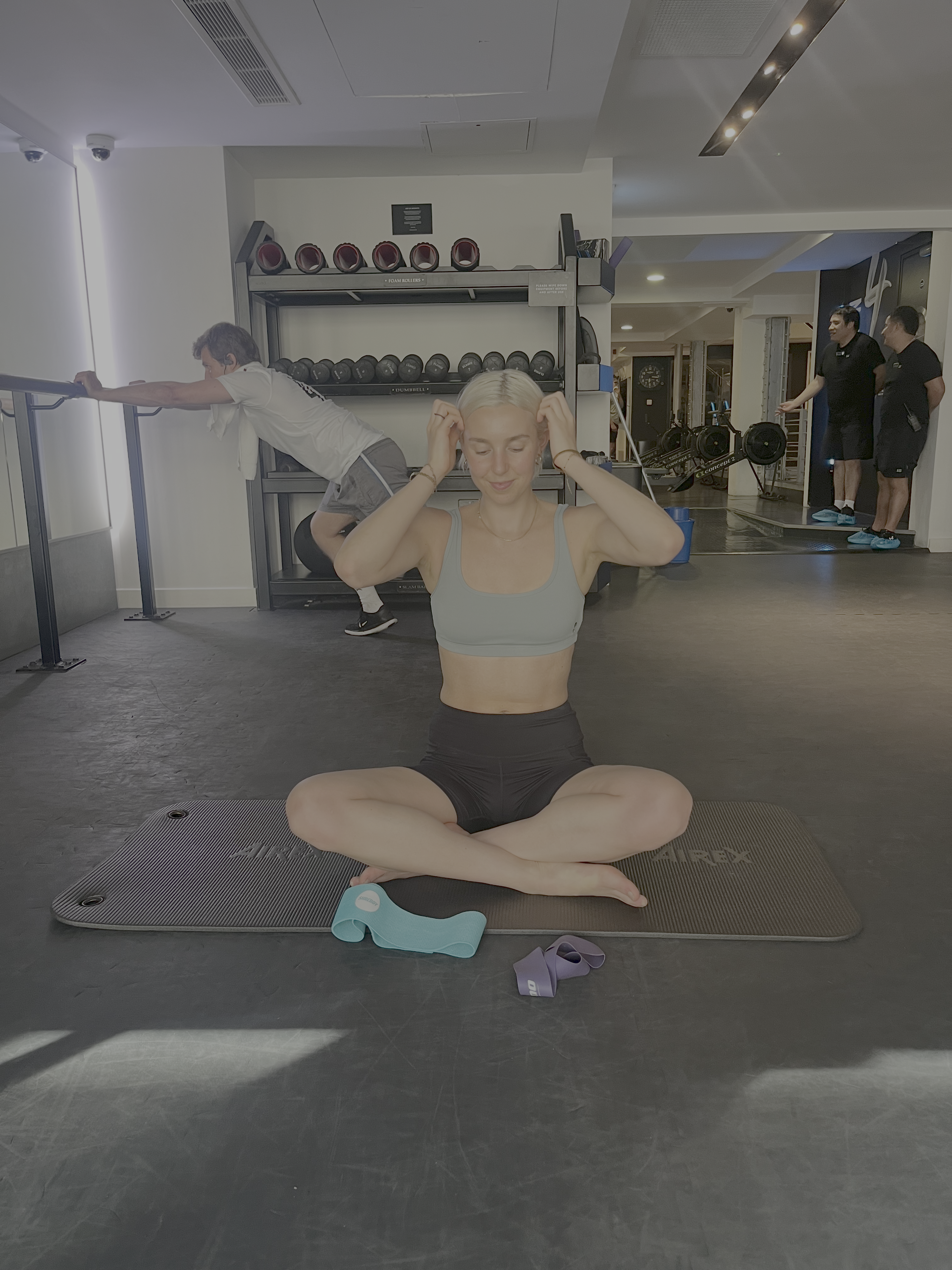 A woman practicing pilates in the gym